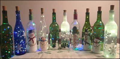 wine bottles with snowmen and other holiday decorations