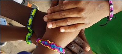 kids' hands with bracelets